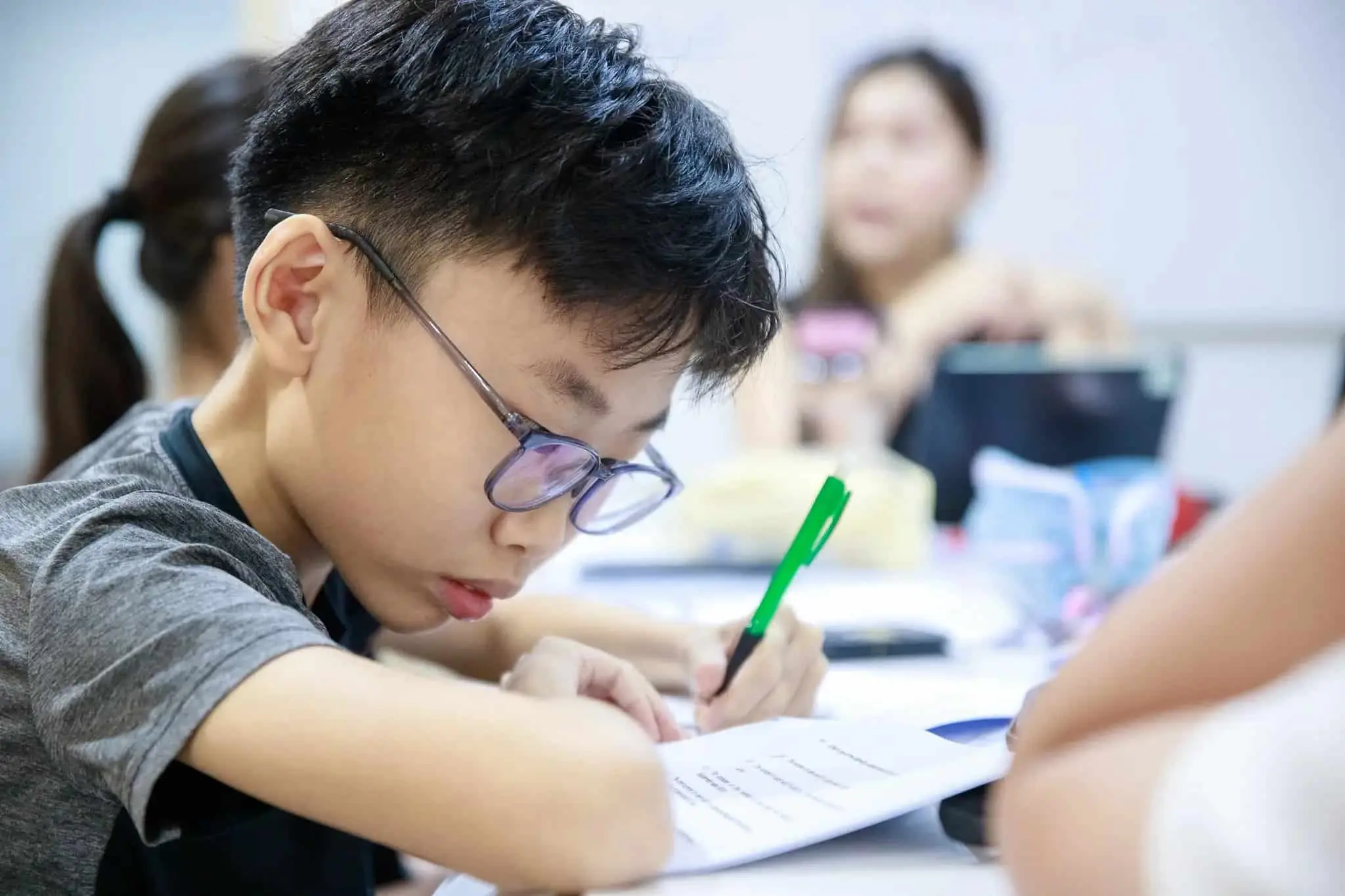 a child is studying seriously